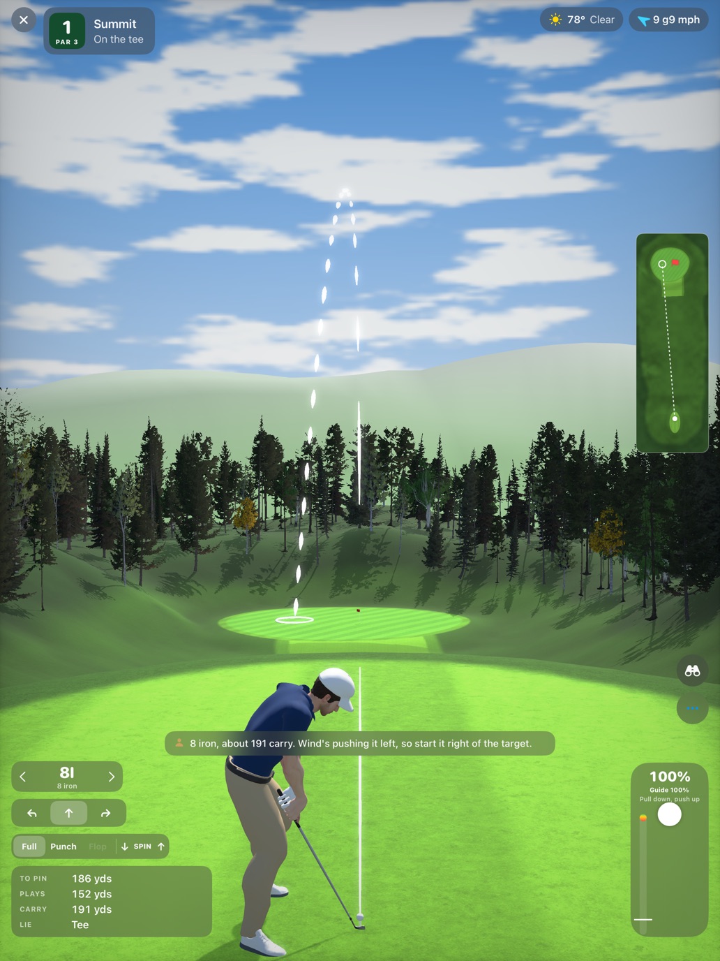 A golfer at the elevated tee of Summit, looking down toward a green set far below among mountain trees